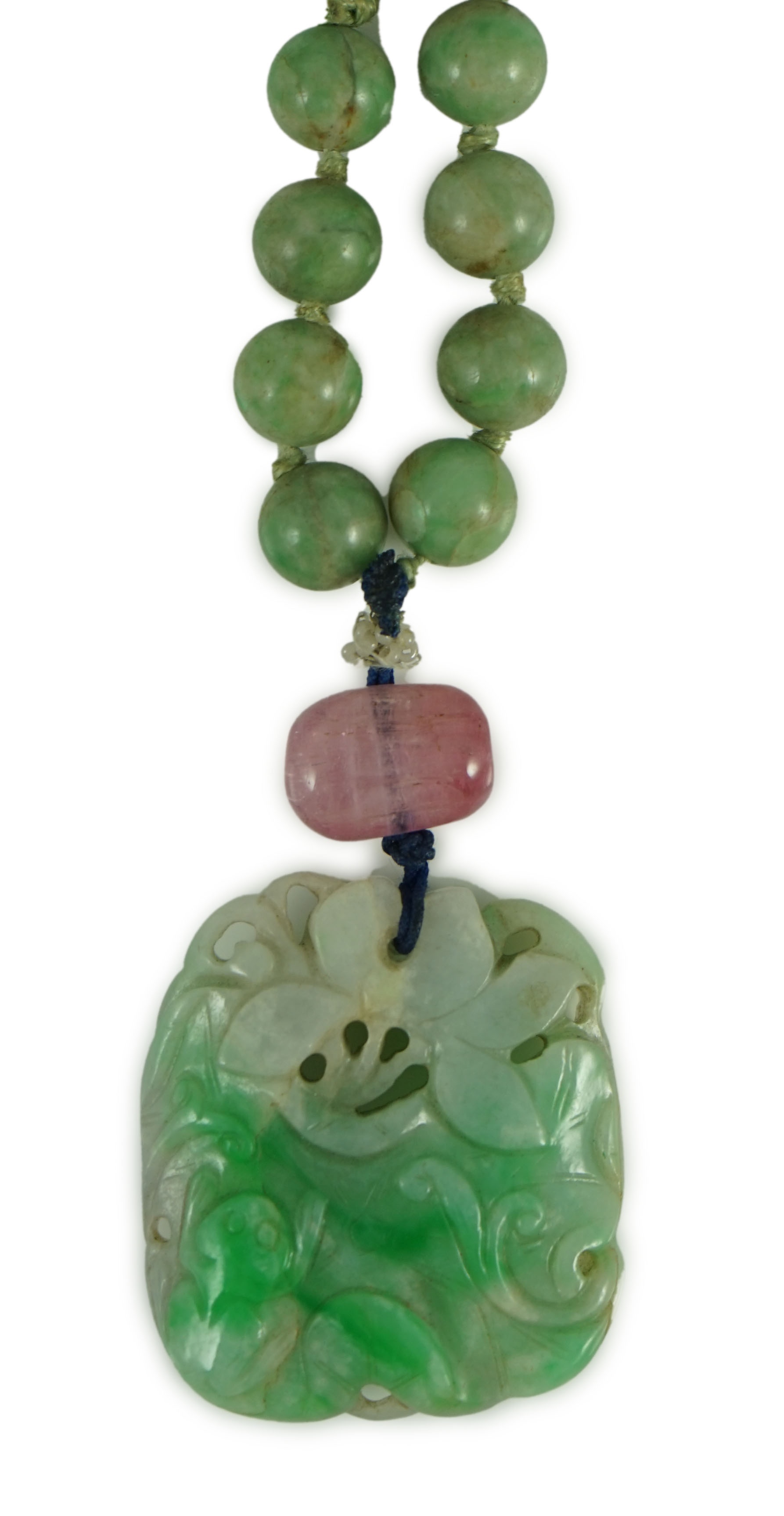 A Chinese jadeite pendant and jadeite beads, 19th century, Pendant 3.9 cm, total drop 68 cm